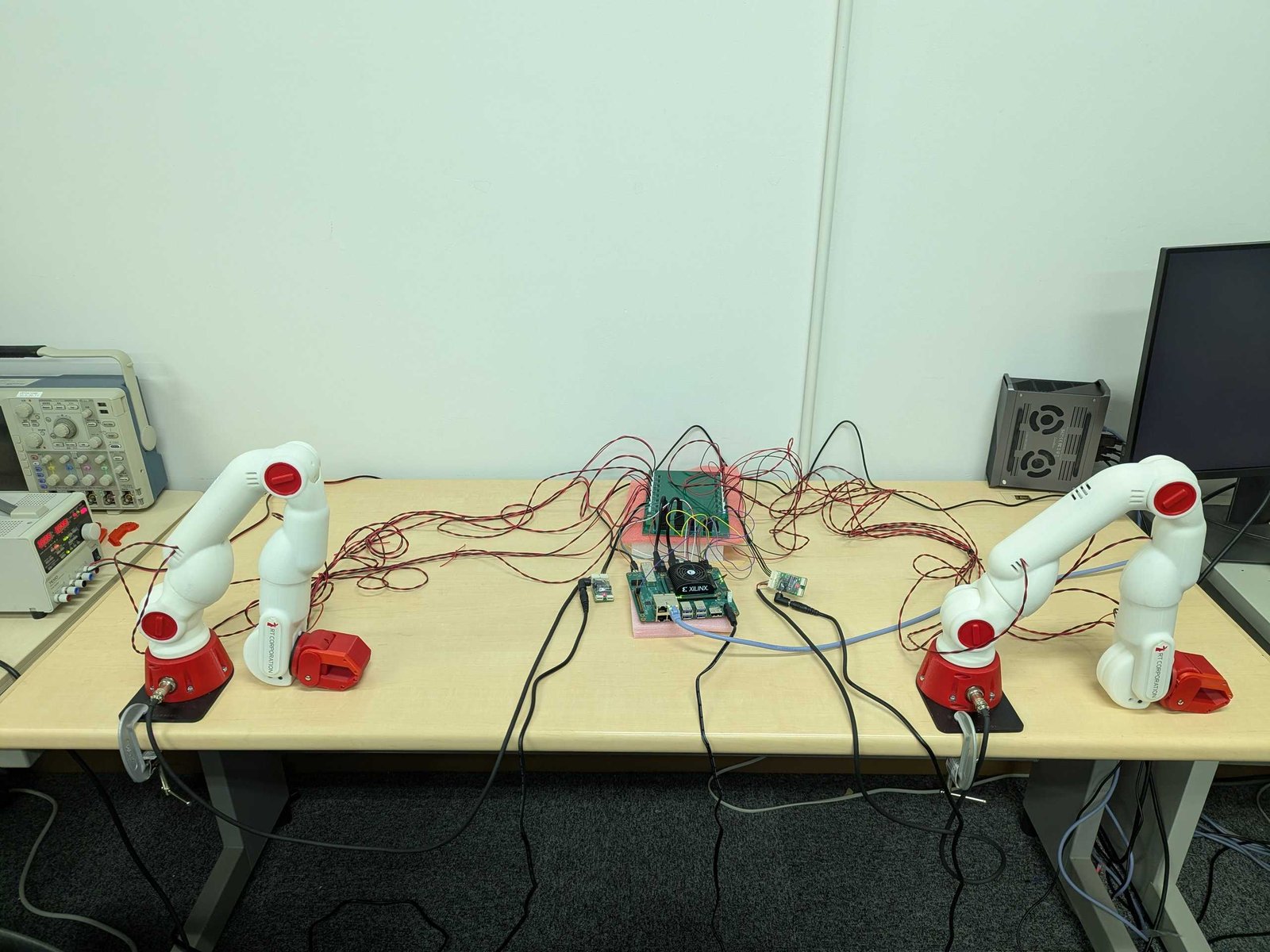 Bilateral control setup with an FPGA board and two pairs of robot arms